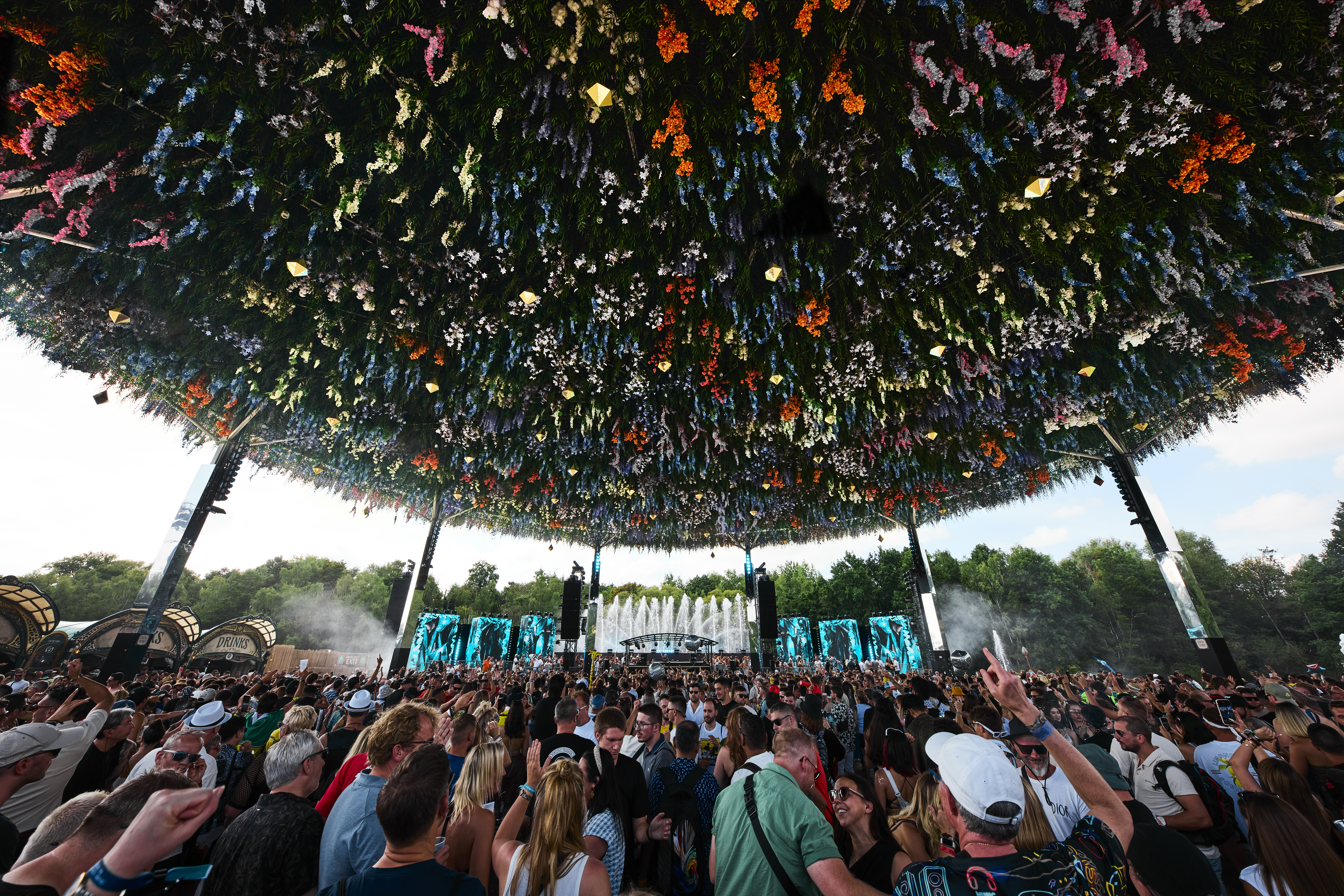 ORON H2 Phosphor-Laser Moving Heads at Crystal Garden Stage at Tomorrowland 2025 with flowers